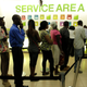 Customers queue inside a Safaricom mobile phone care center downtown Nairobi.